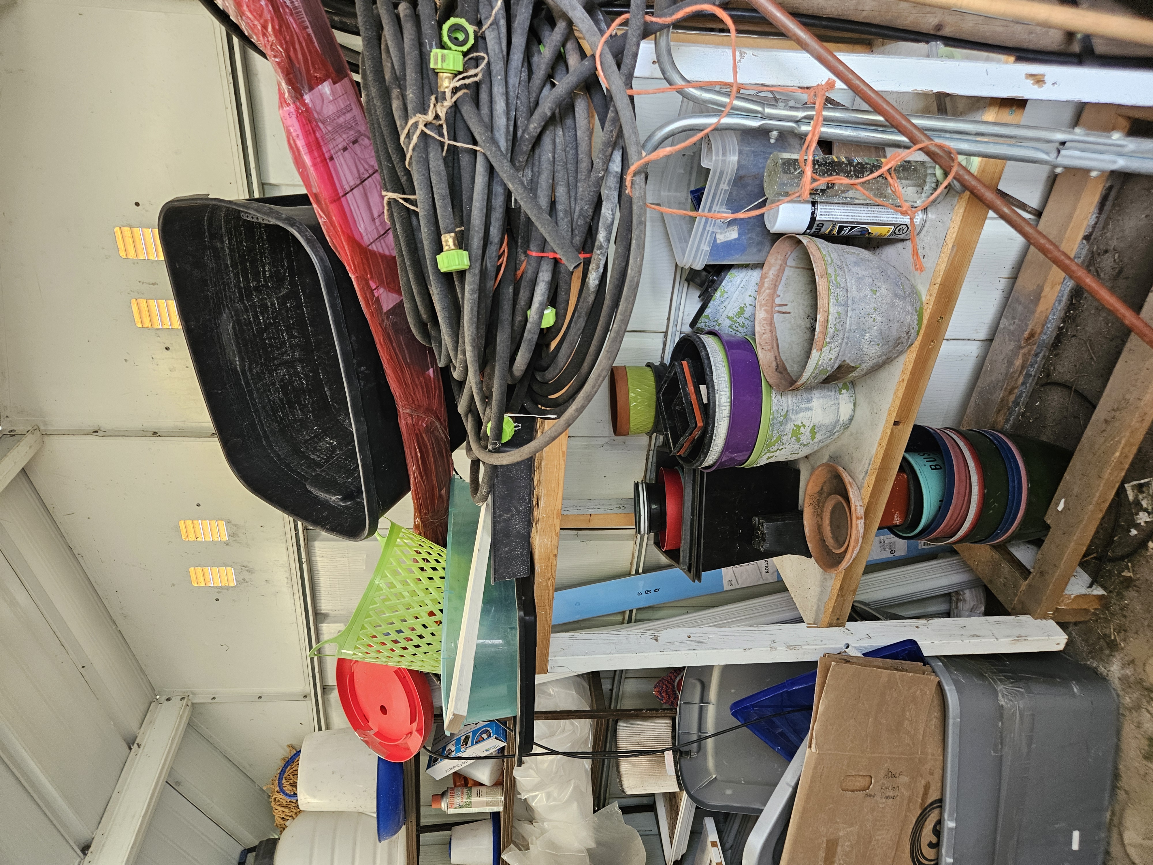 The shed before — tools, hoses, pots, and a winter’s worth of I’ll-deal-with-it-later